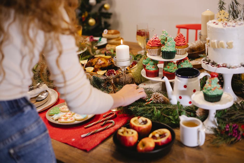 Festive dessert table setup with holiday treats and Christmas decorations, perfect for a warm celebration.