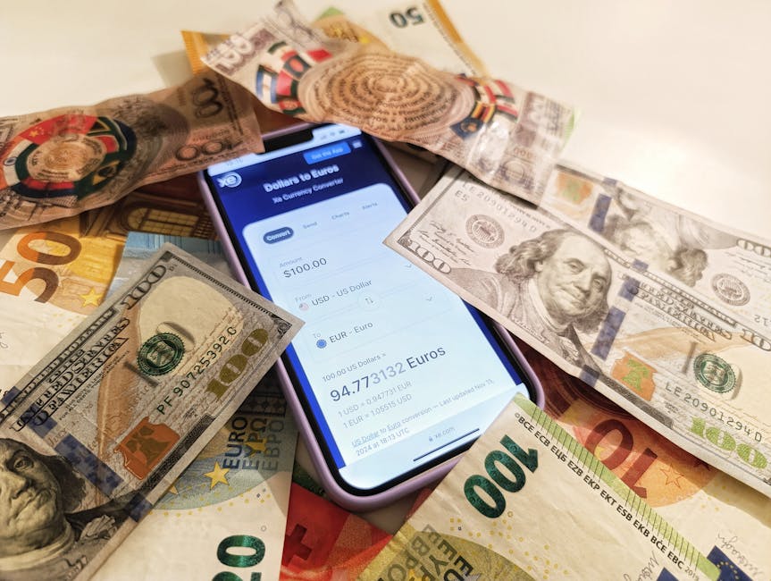 A smartphone displaying a currency converter surrounded by dollar and euro banknotes, highlighting exchange rates.