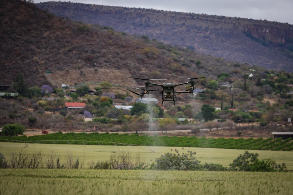 High-tech drone spraying crops for precision agriculture in a rural setting.